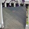 Handmade upcycled vinyl tote bag with purple African quilted fabric lining.